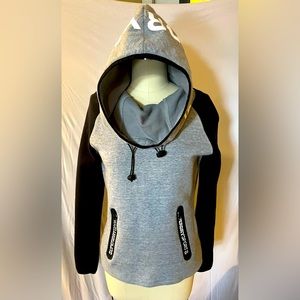 Superdry. Women’s XS. Gray and Black athletic top.